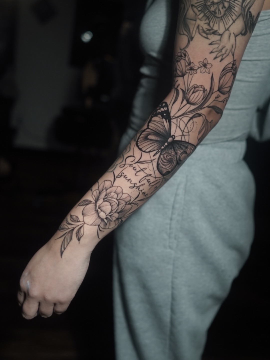Floral bouquet fine line tattoo on the forearm by Niko Hosk Cataldo