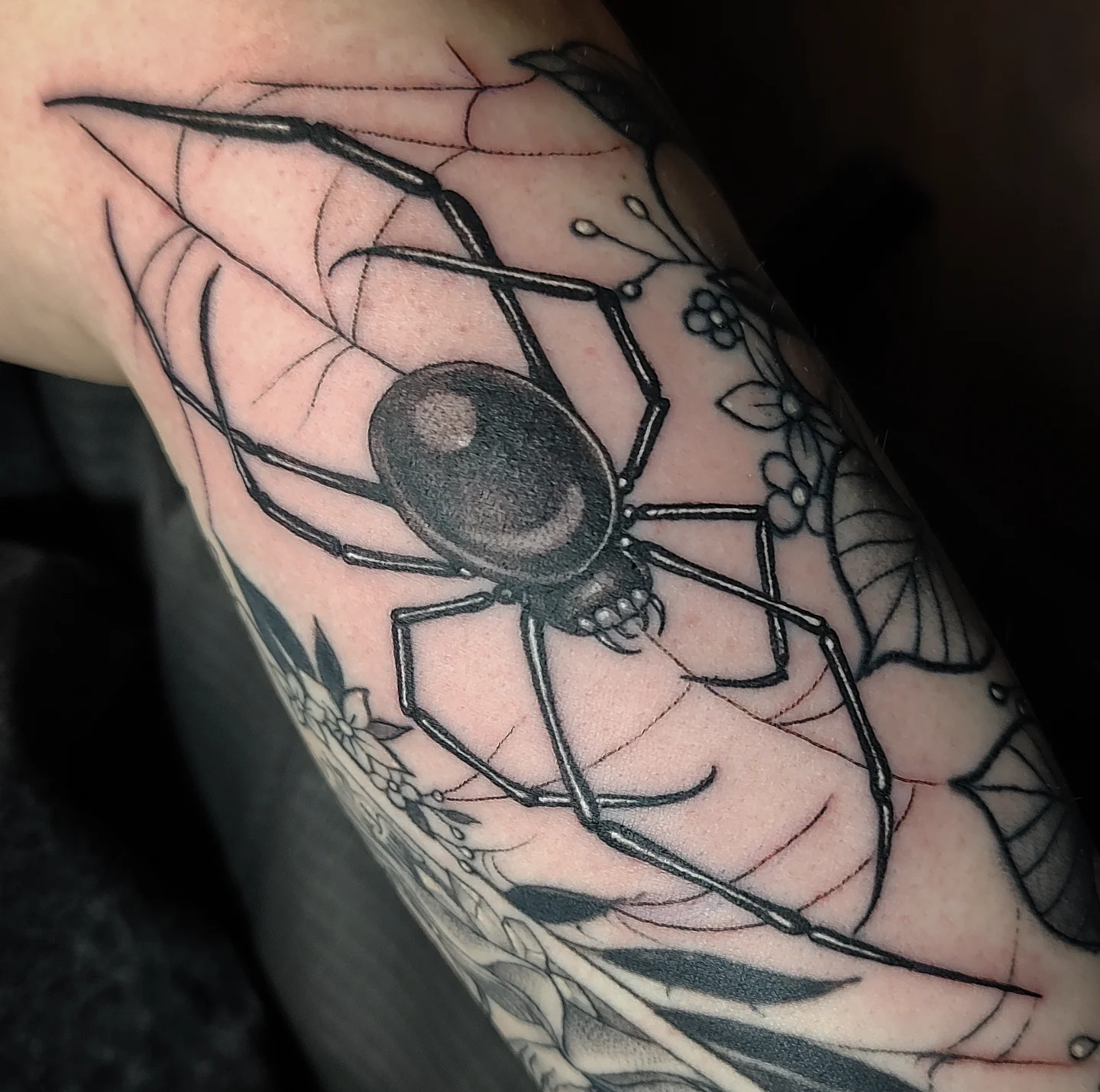 Spider black and grey tattoo on the forearm by Jennifer Fowler