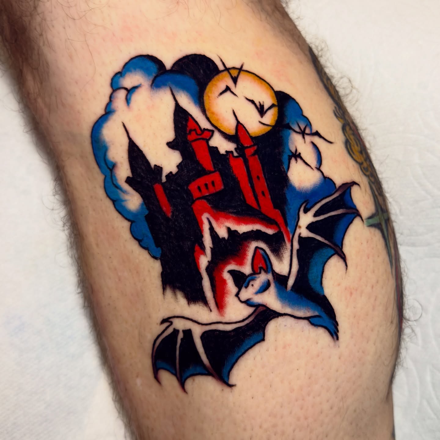 Bat and castle American traditional tattoo on the forearm by Haley Tucker, Sebastopol, California