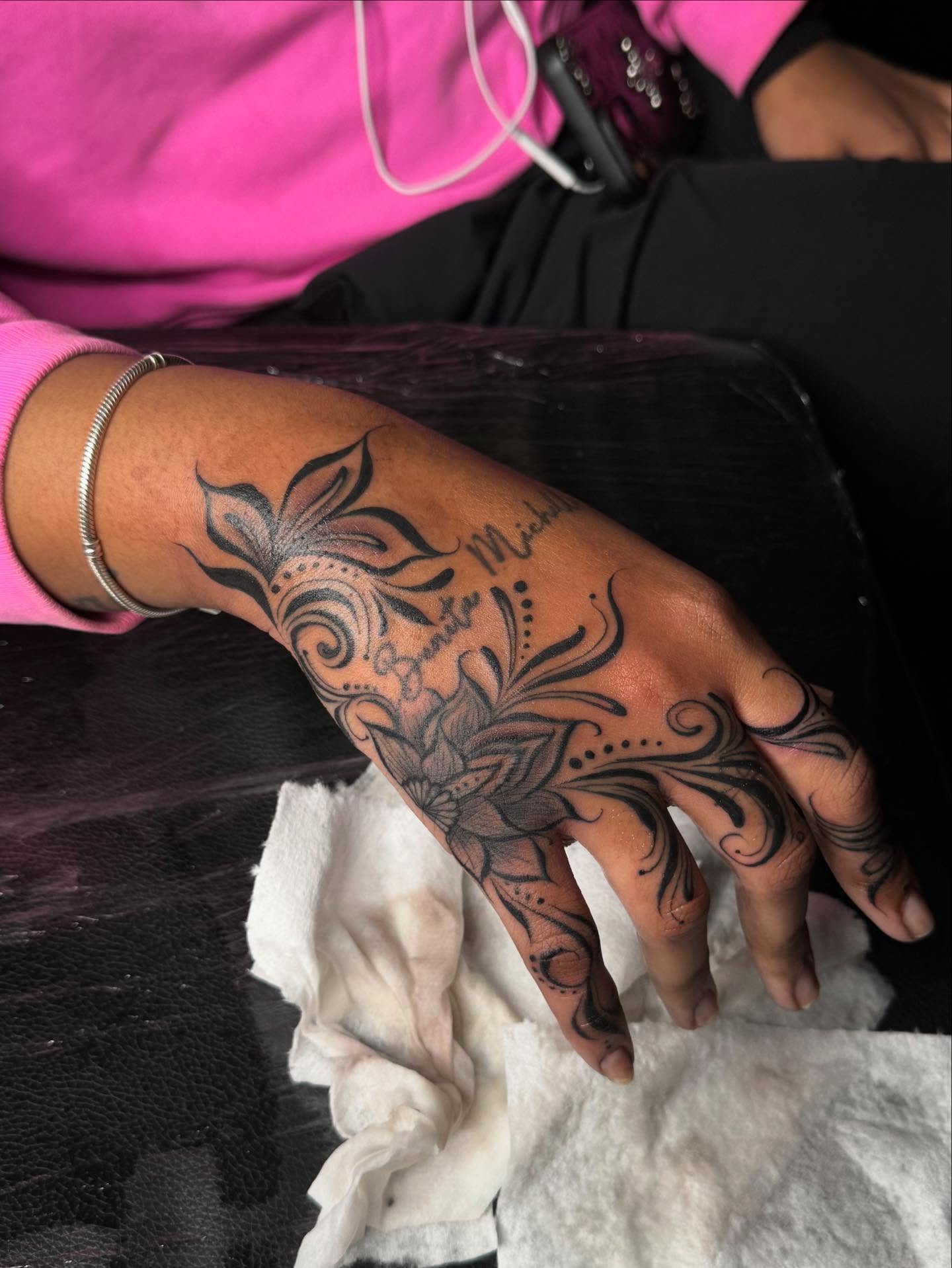 Floral design black and grey tattoo on the hand by Tattedbytrinn
