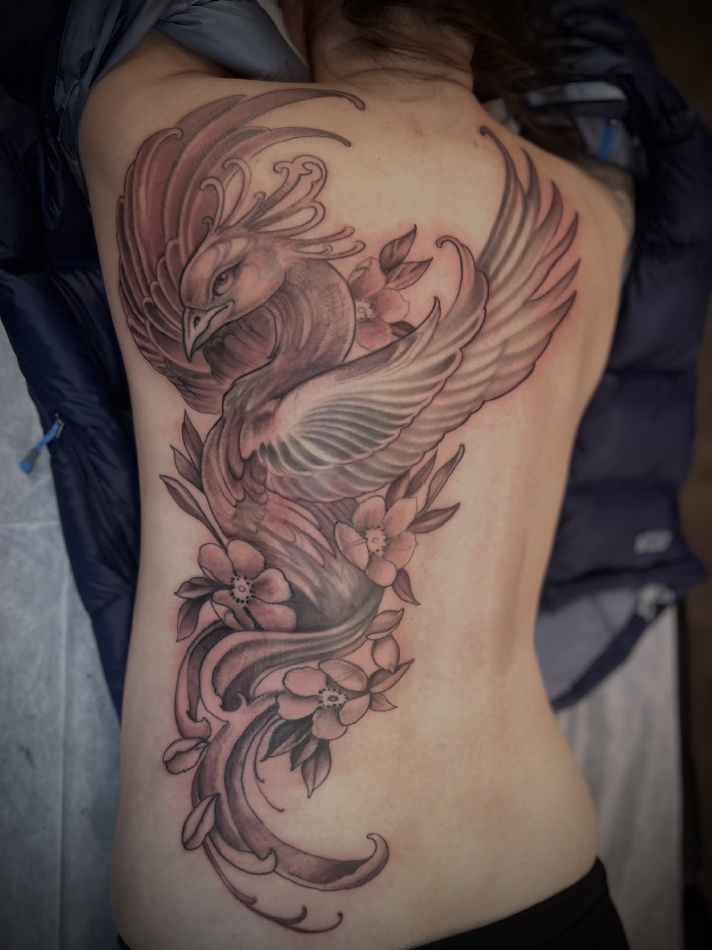 Phoenix and flowers black and grey tattoo on the back by Ryan Willard, Denver, Colorado