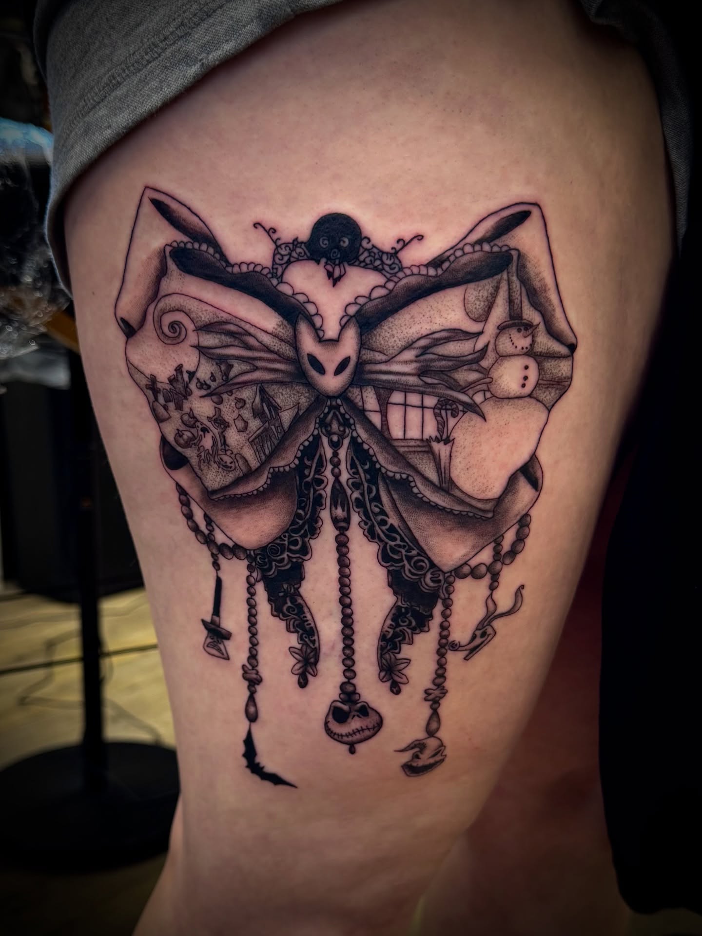 Butterfly dark realism tattoo on the thigh by Gianna G