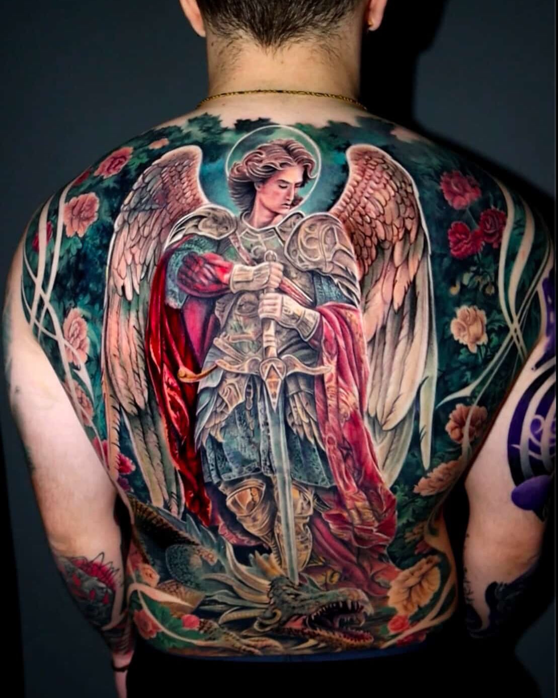 Angel slaying dragon realism tattoo on the back by Gary Barrera