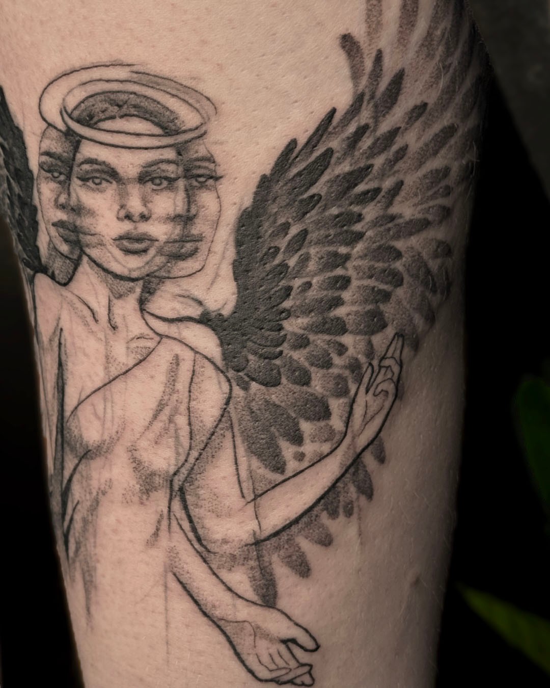 Angel black and grey tattoo on the forearm by Erin Isaacs