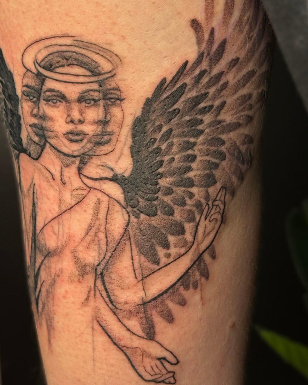Angel black and grey tattoo on the forearm by Erin Isaacs