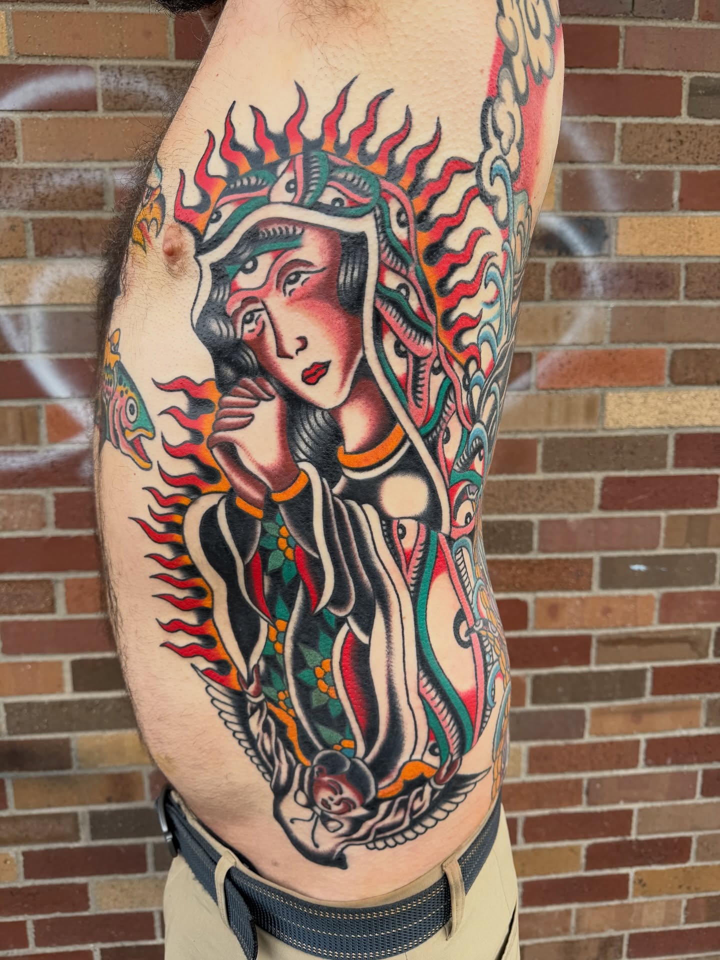 Japanese deity American traditional tattoo on the thigh by Nick Judkins Tattoo