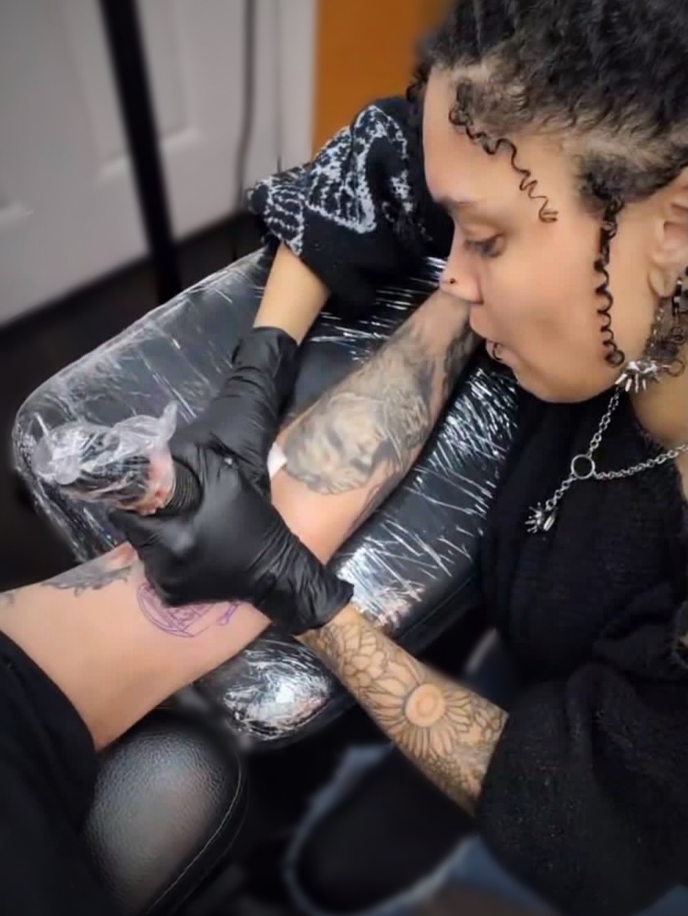 Floral design black and grey tattoo on the forearm by Bree Burgess