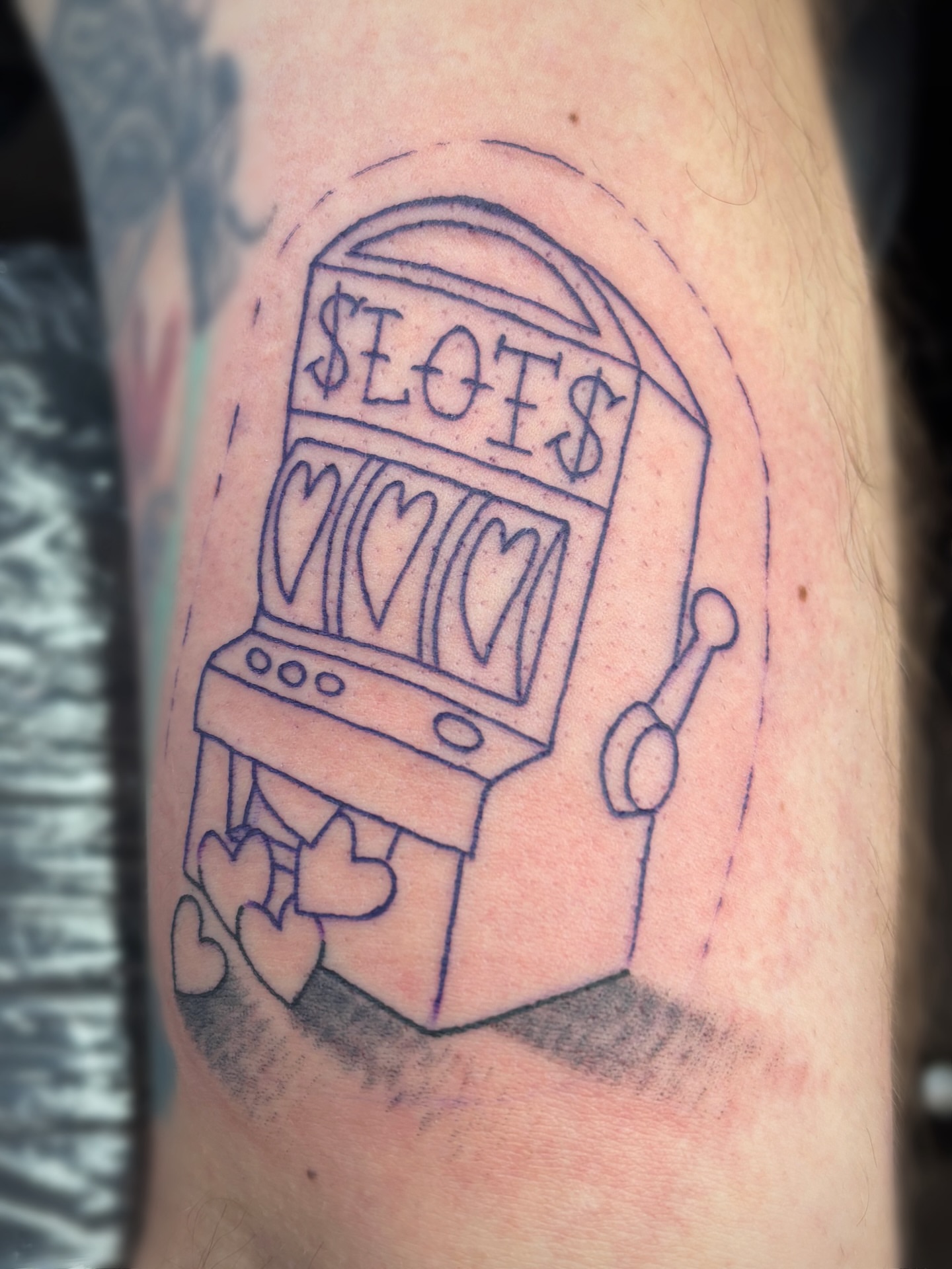 Slot machine black and grey tattoo on the forearm by Bree Burgess
