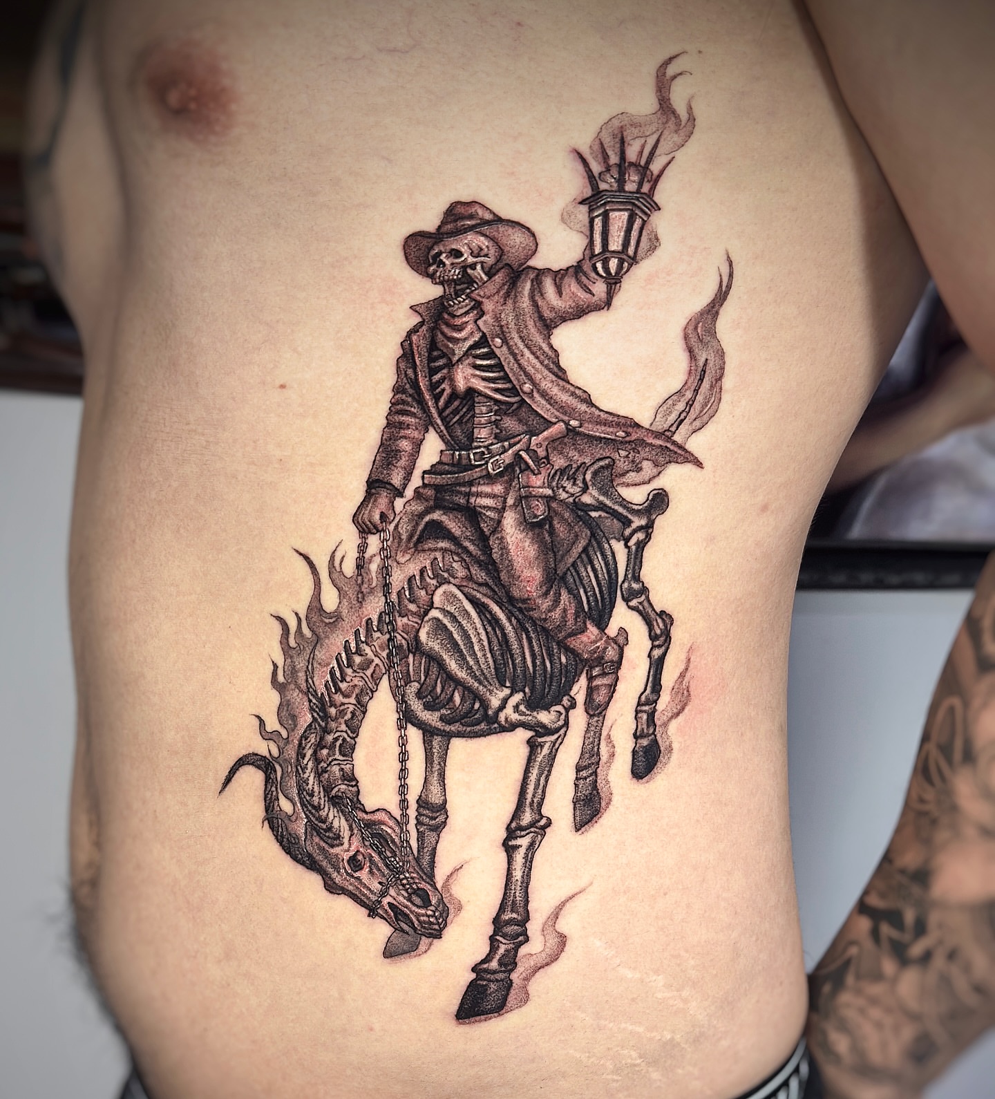 Skeleton cowboy realism tattoo on the ribs by Jemin Ren