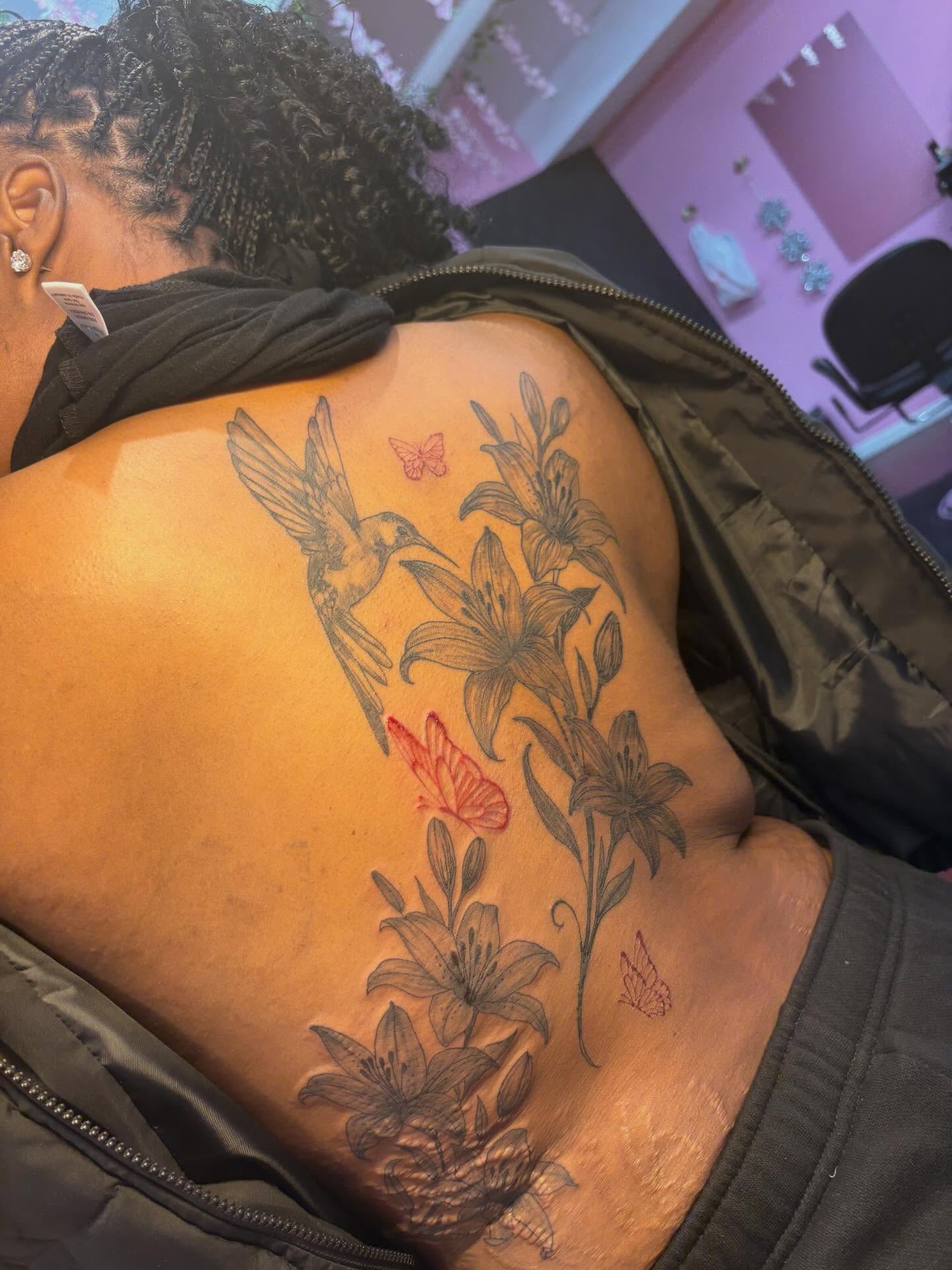 Hummingbird and lilies black and grey tattoo on the back by addicted222inkk🎨