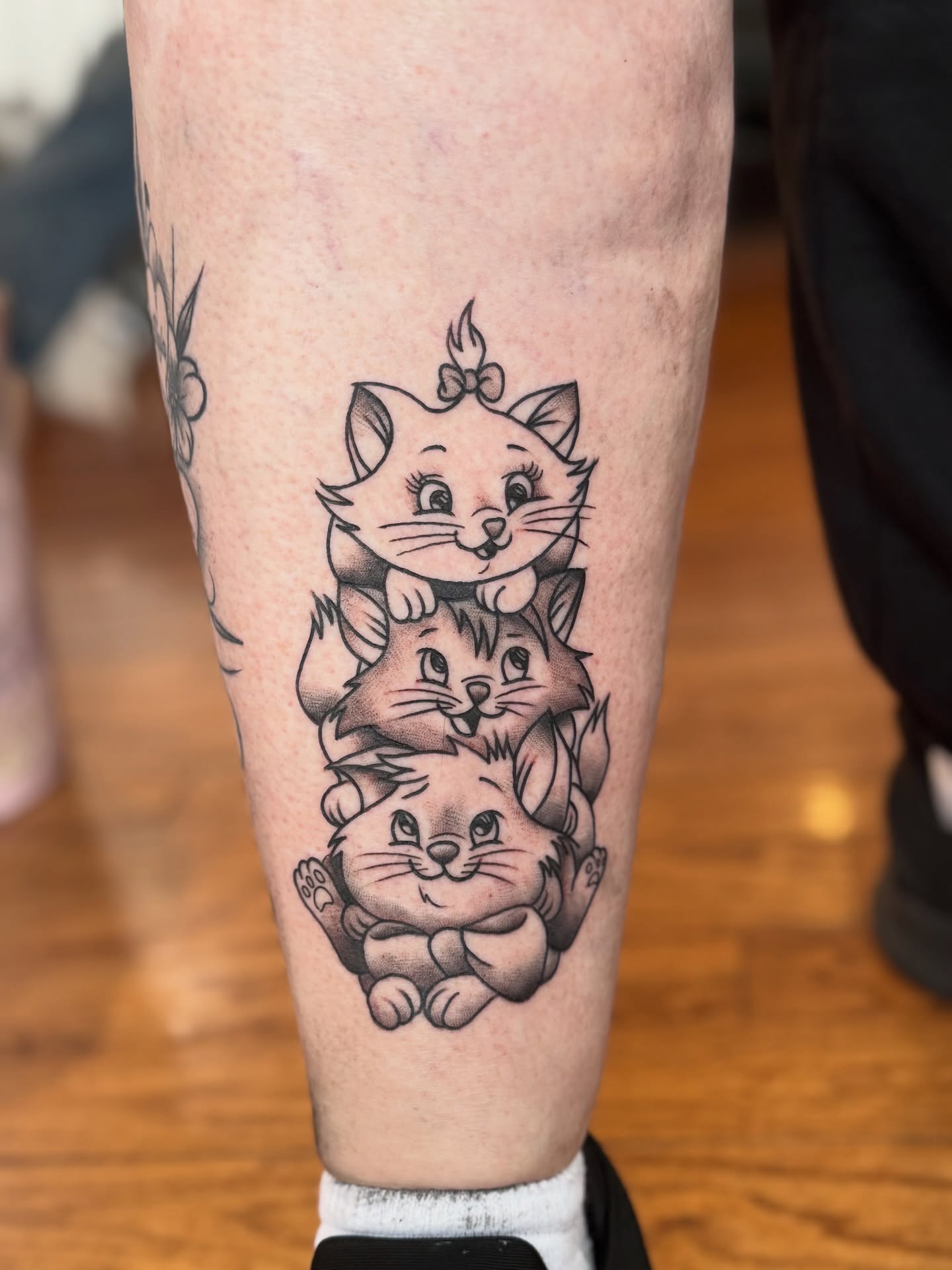 Three kittens black and grey tattoo on the calf by juice🕷tattoo artist