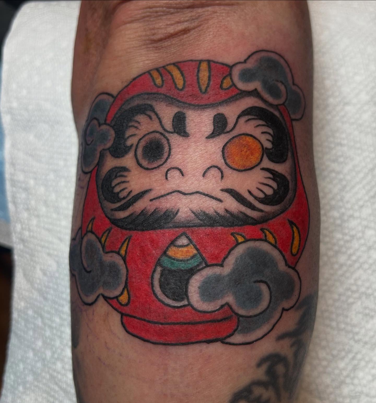 Daruma doll American traditional tattoo on the forearm by Casey Lewis - Tattoo Artist, Cleveland Ohio