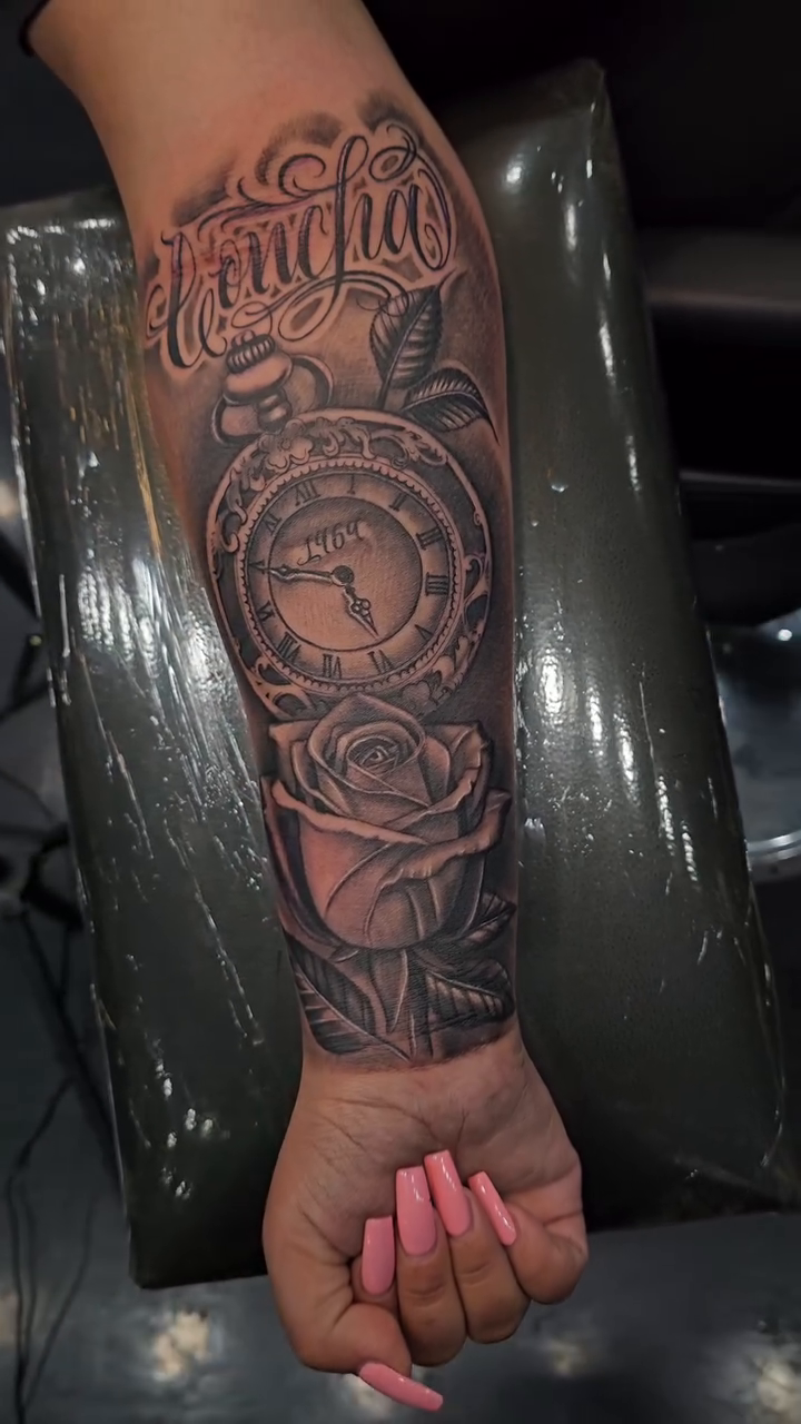 Clock and rose with script Chicano tattoo by Richie Garcia, Hesperia, California