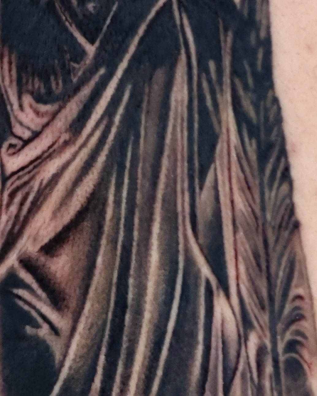 Feather black and grey tattoo on the forearm by Scott!!!