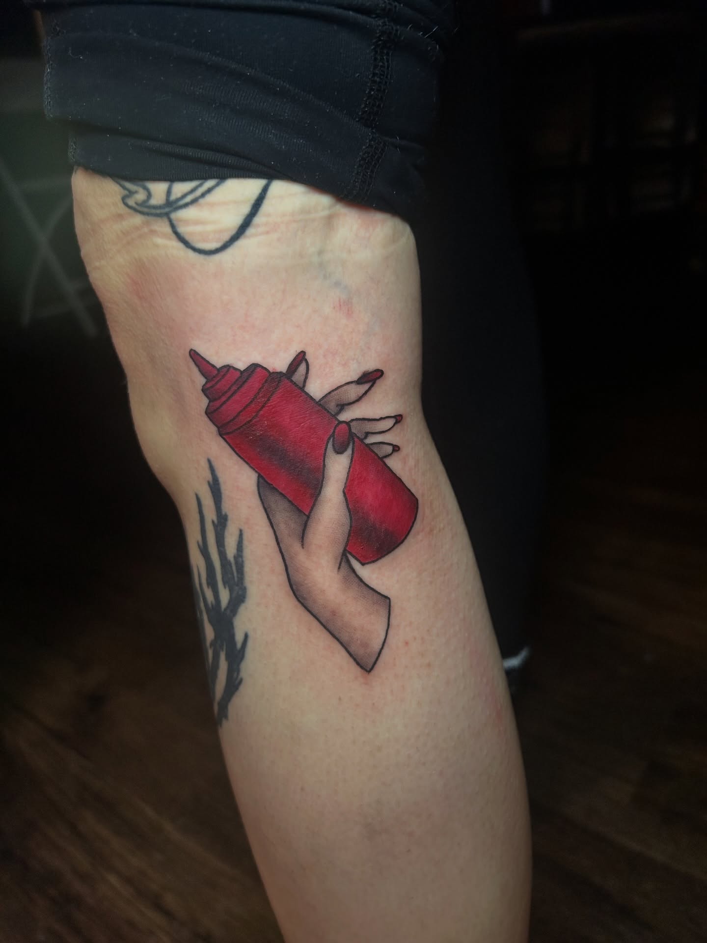 Ketchup bottle realism tattoo on the forearm by Vanessa Kendyll’s Tattoos