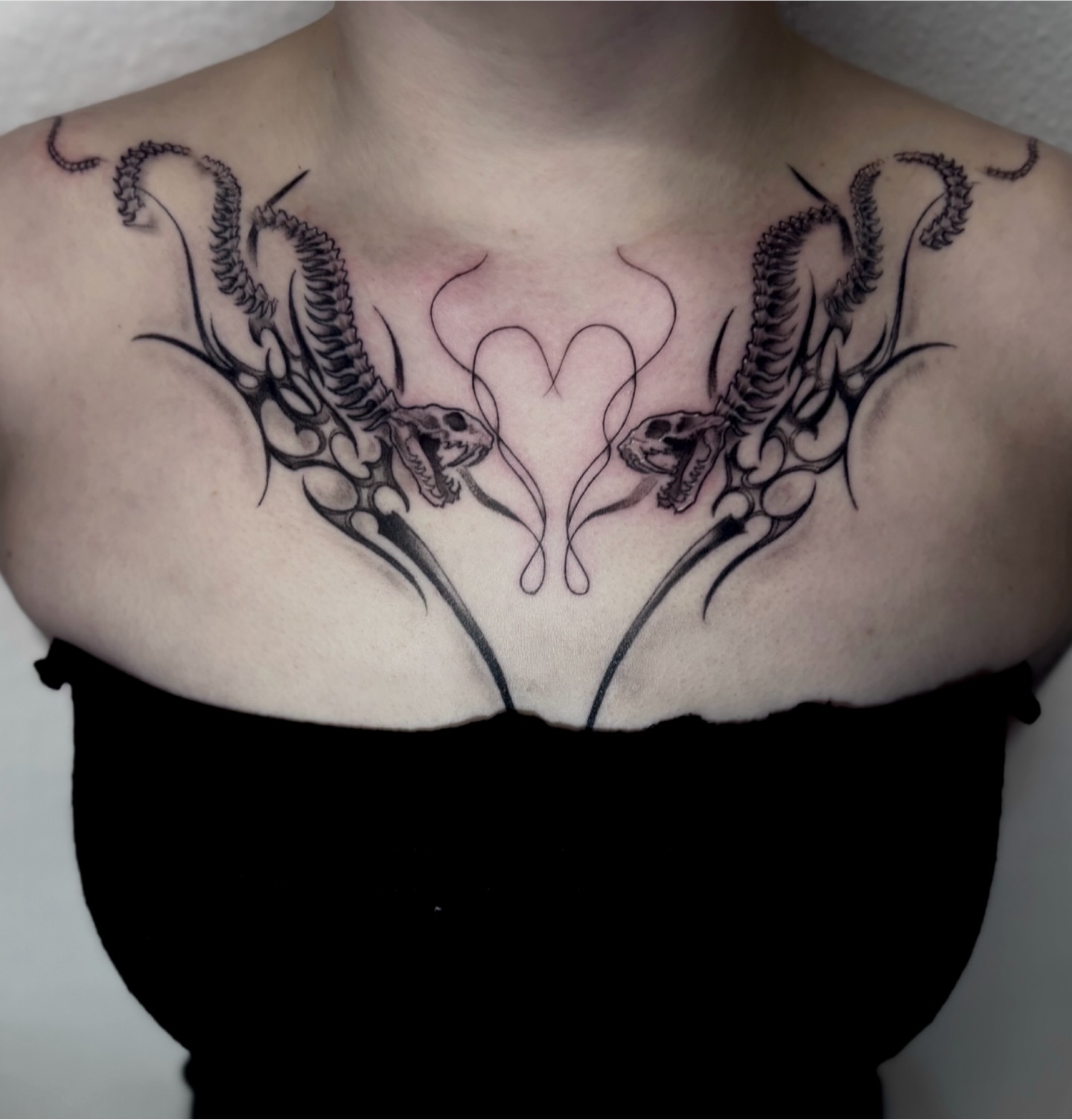 Skulls and tentacles tribal tattoo on the chest by Elixabeth
