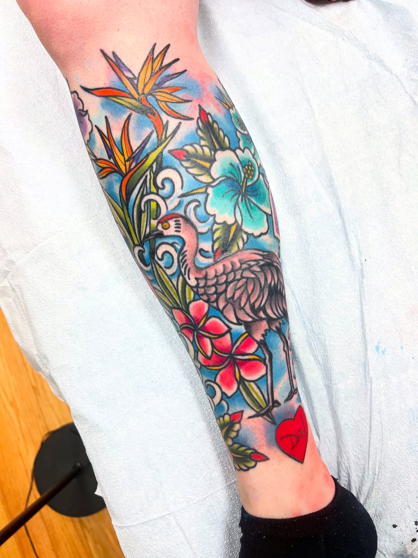 Flamingo and tropical flowers new school tattoo on the forearm by Shannon Pagliarini
