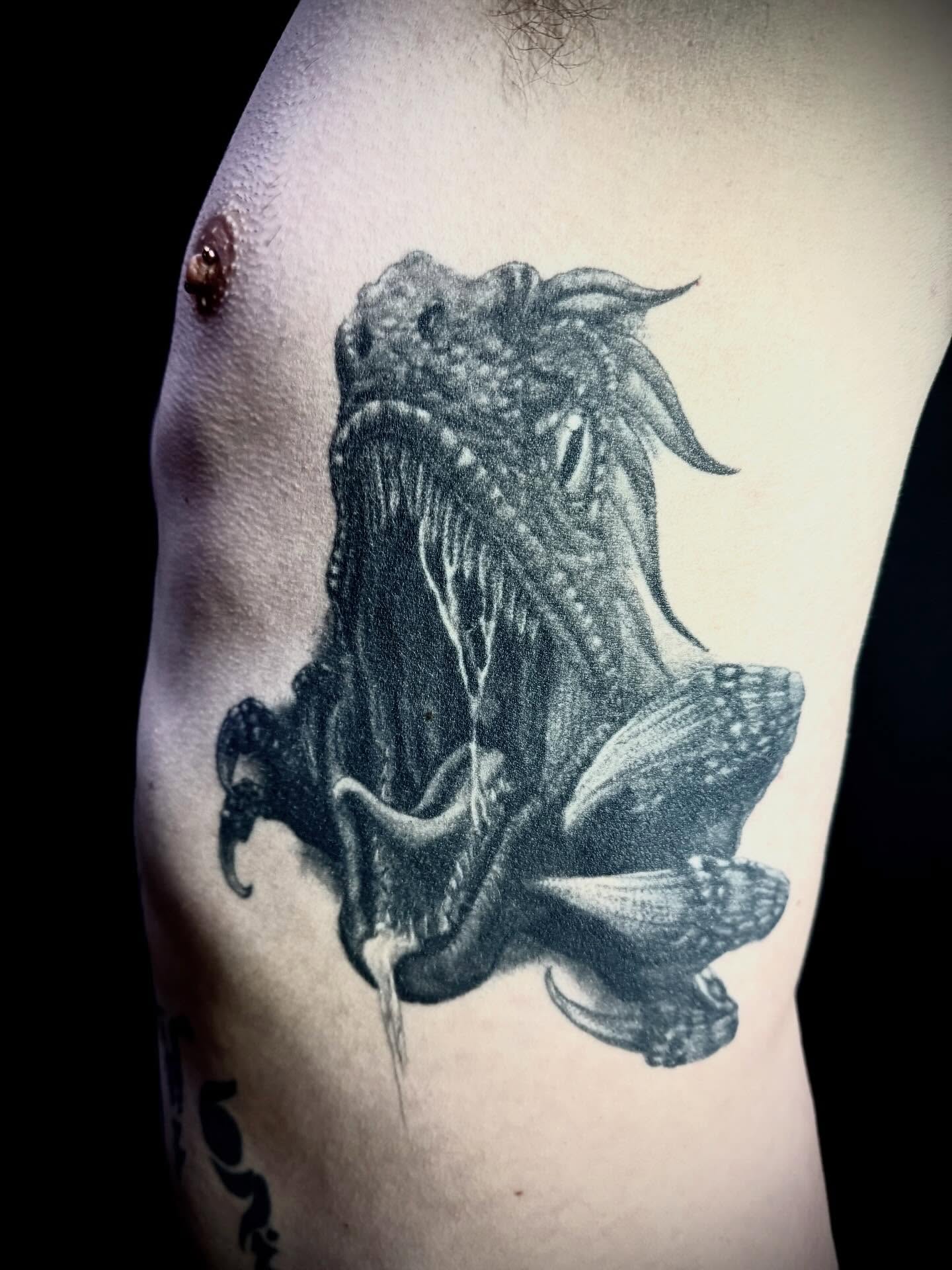Octopus realism tattoo on the ribs by C. Compa