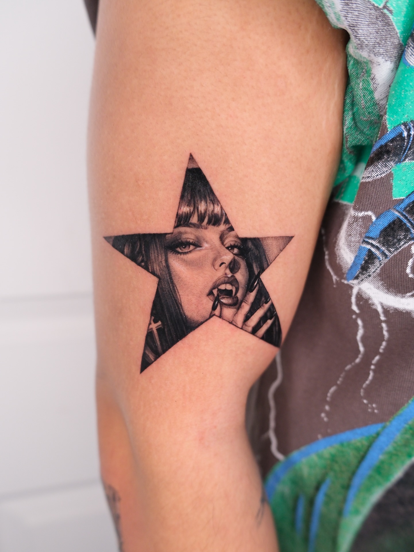Star with woman realism tattoo on the forearm by Bay Area Tattoo Artist