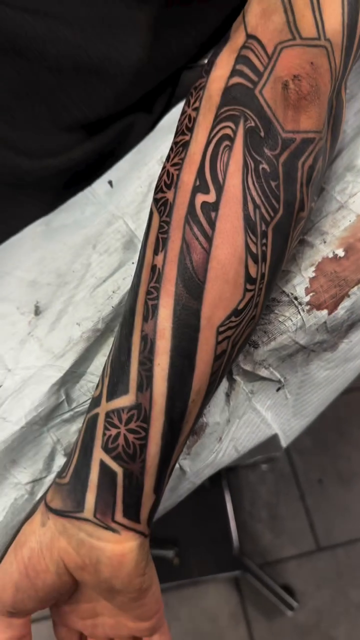 Tattoo by @severeink — geometric, blackwork