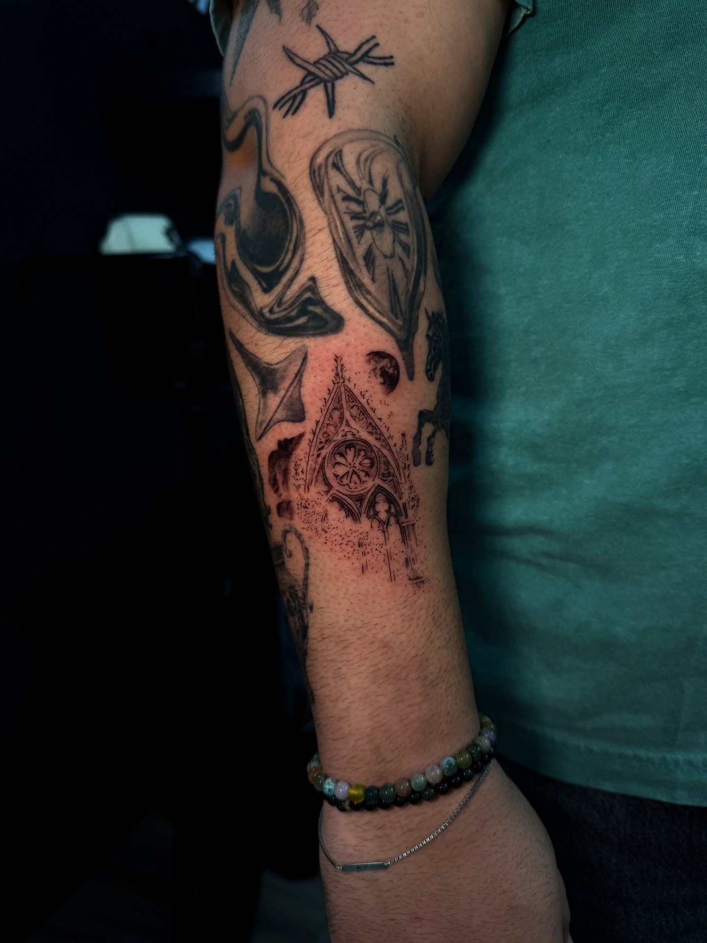 Church black and grey tattoo on the forearm by Elijah Cosme, Miami, Florida