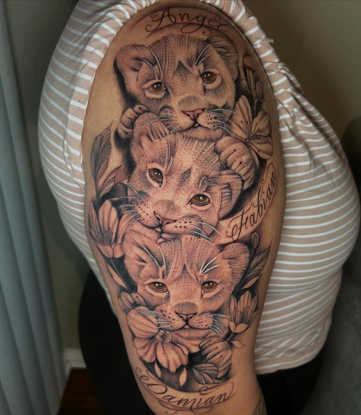 Lion cubs realism tattoo on the forearm by Dany