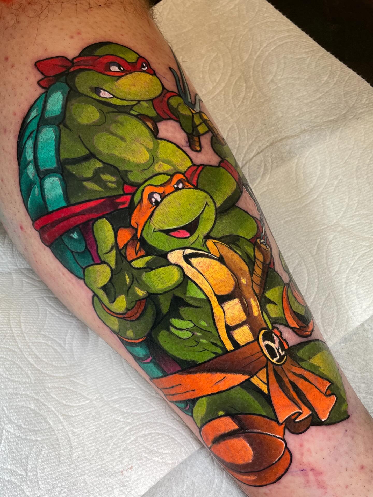 Teenage Mutant Ninja Turtles new school tattoo on the forearm by Kenneth Ruiz