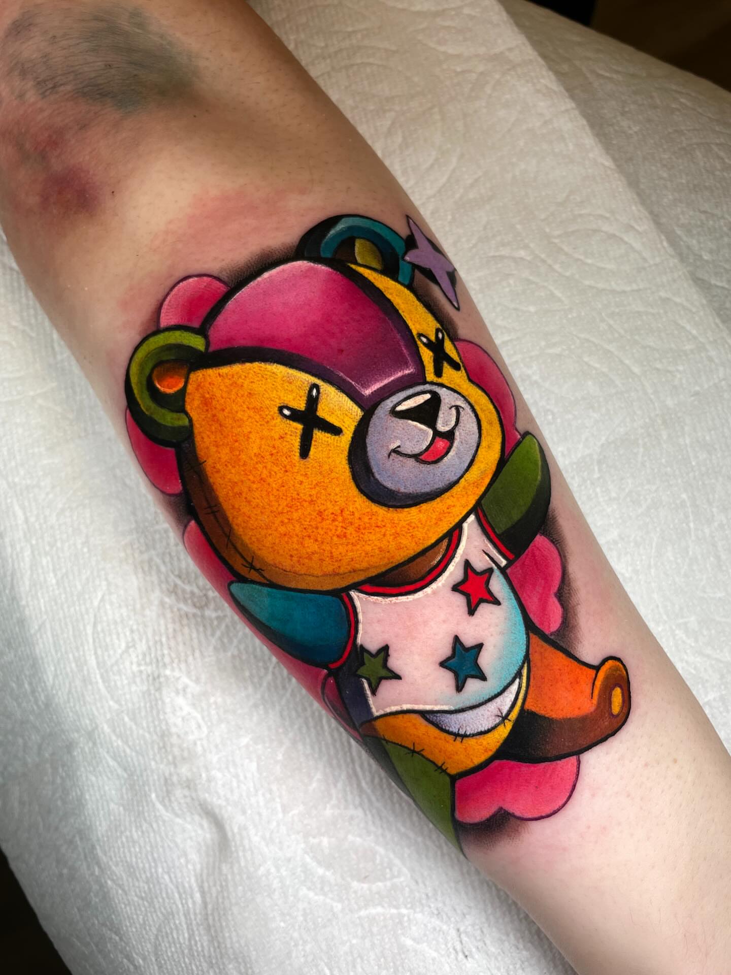 Teddy bear new school tattoo on the forearm by Kenneth Ruiz