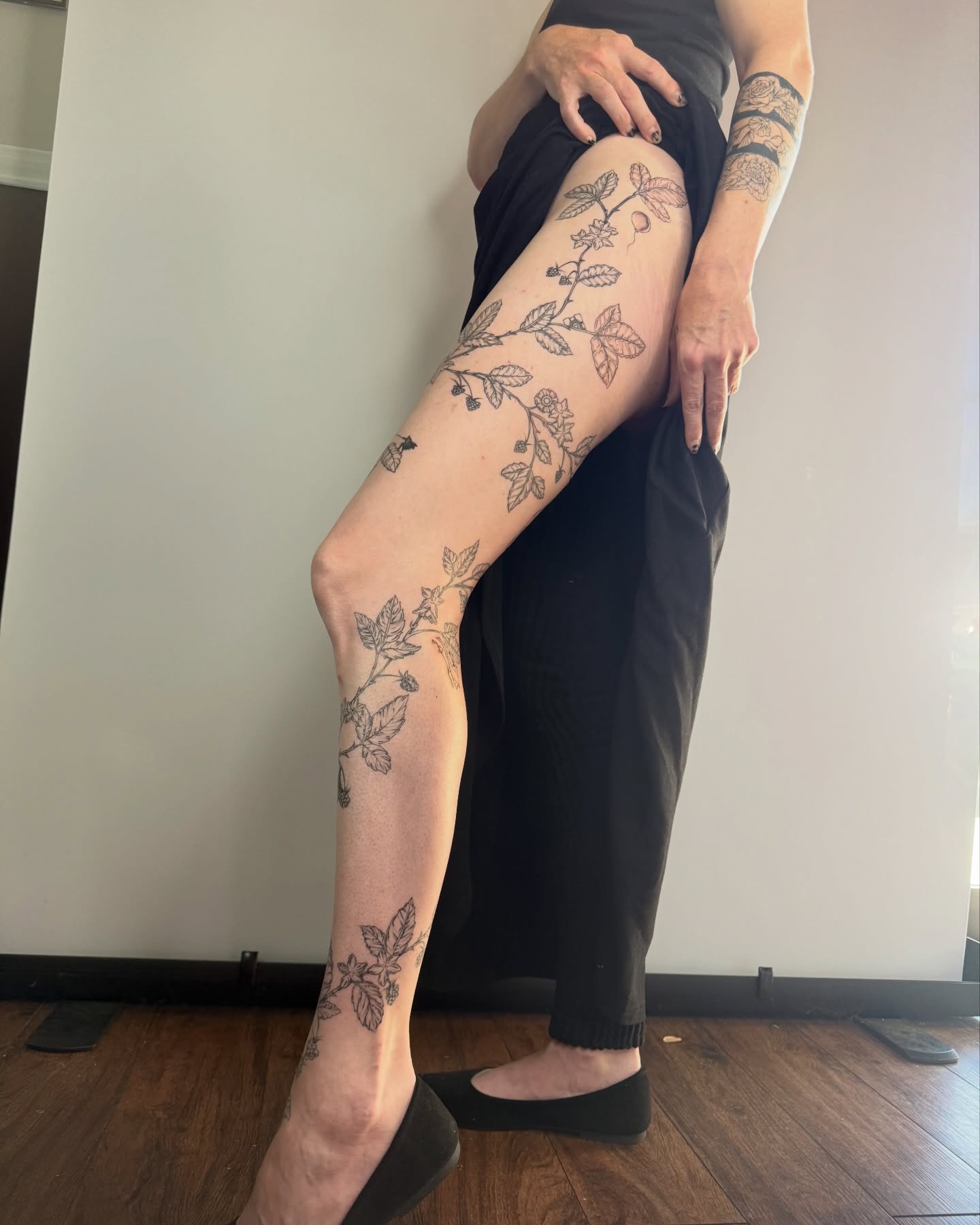 Botanical vine black and grey tattoo on the leg by Brandie