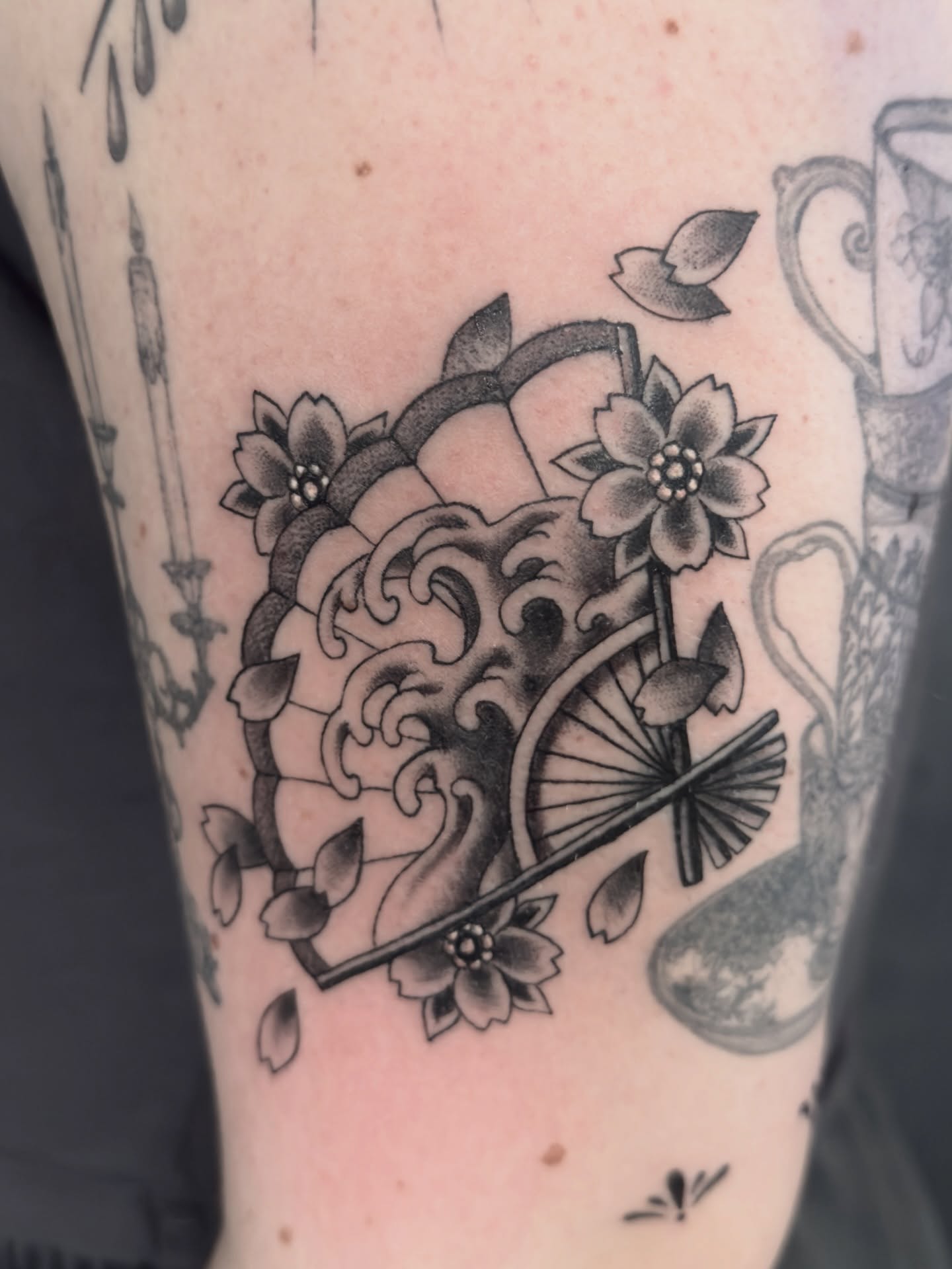 Wave and fan japanese irezumi tattoo on the forearm by Scott Kulikowski