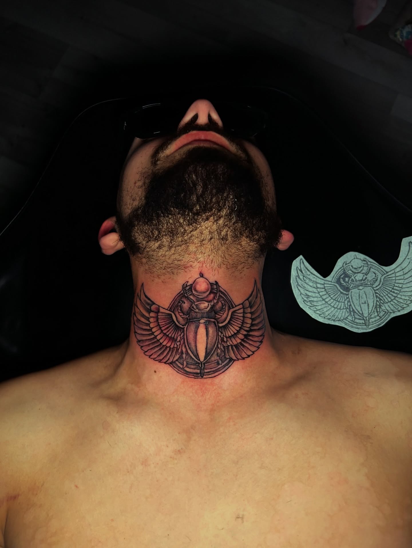 Scarab beetle black and grey tattoo on the neck by Porshamonie' THE Tattoo ARTIST