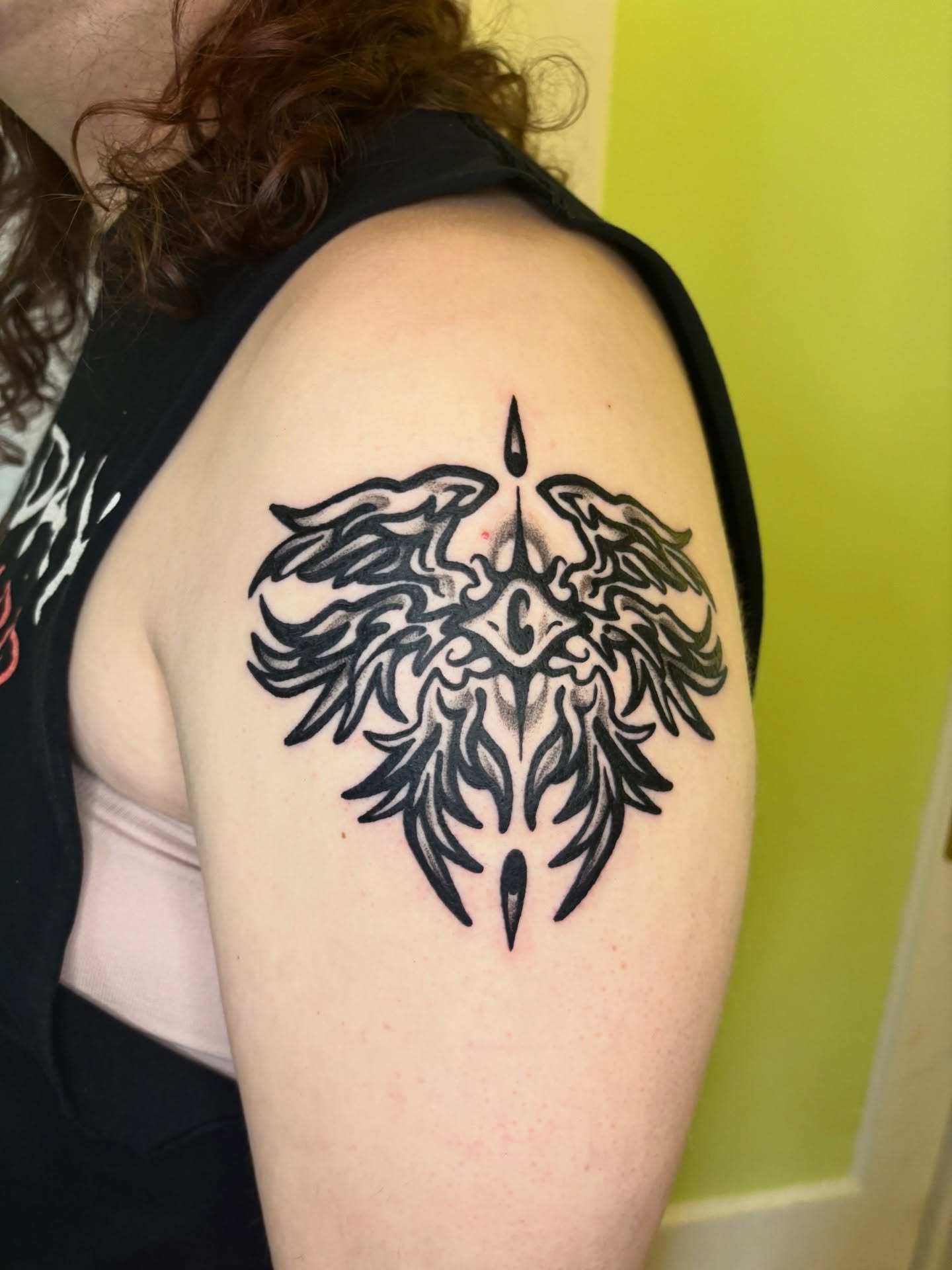 Phoenix tribal tattoo on the shoulder by Grae