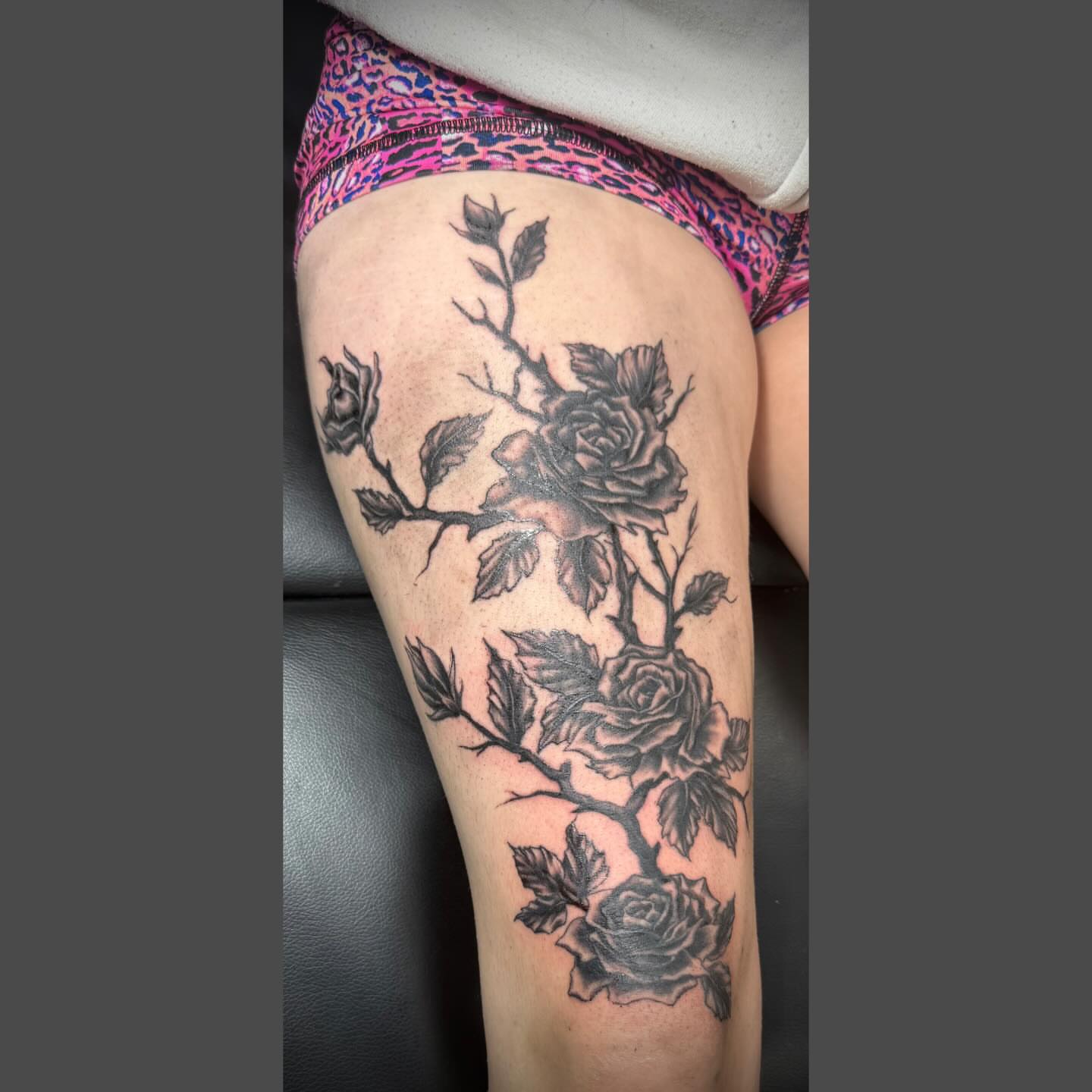 Roses black and grey tattoo on the thigh by Richard Nagy, New Orleans, Louisiana