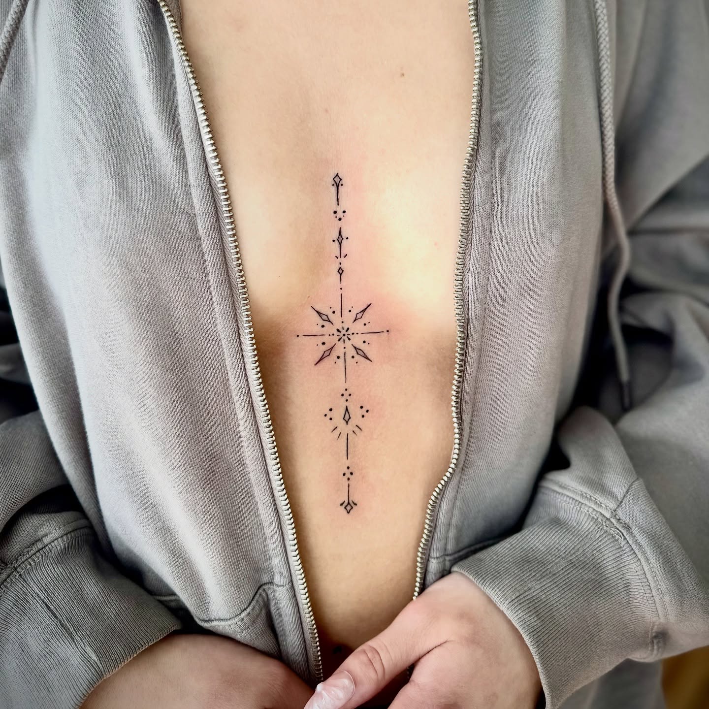 Geometric design geometric tattoo on the chest by Lindsay Shriver
