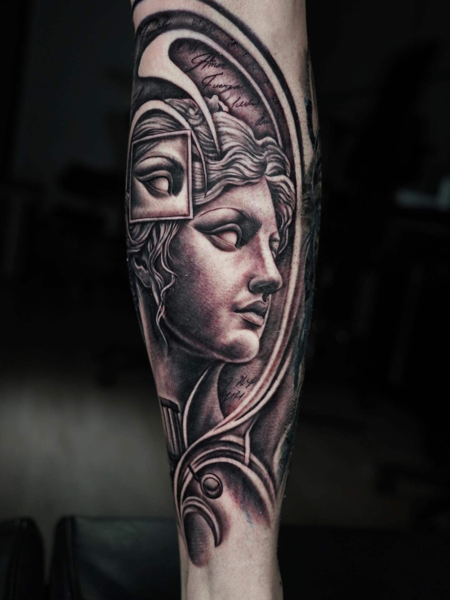 Statue head realism tattoo on the forearm by J Camilo Rincon