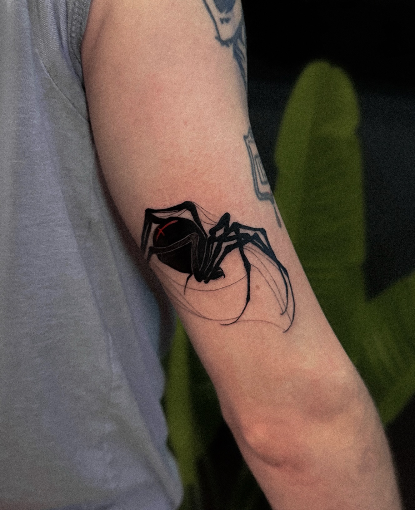 Spider blackwork tattoo on the forearm by Tattoo Artist 👩🏻‍🎨 ATX