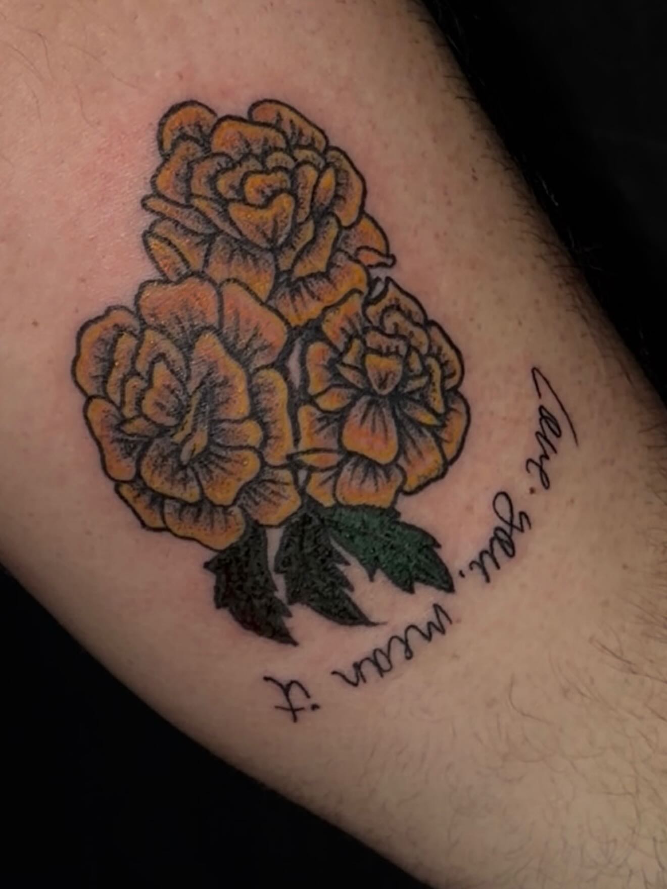 Marigolds American traditional tattoo on the forearm by cortez