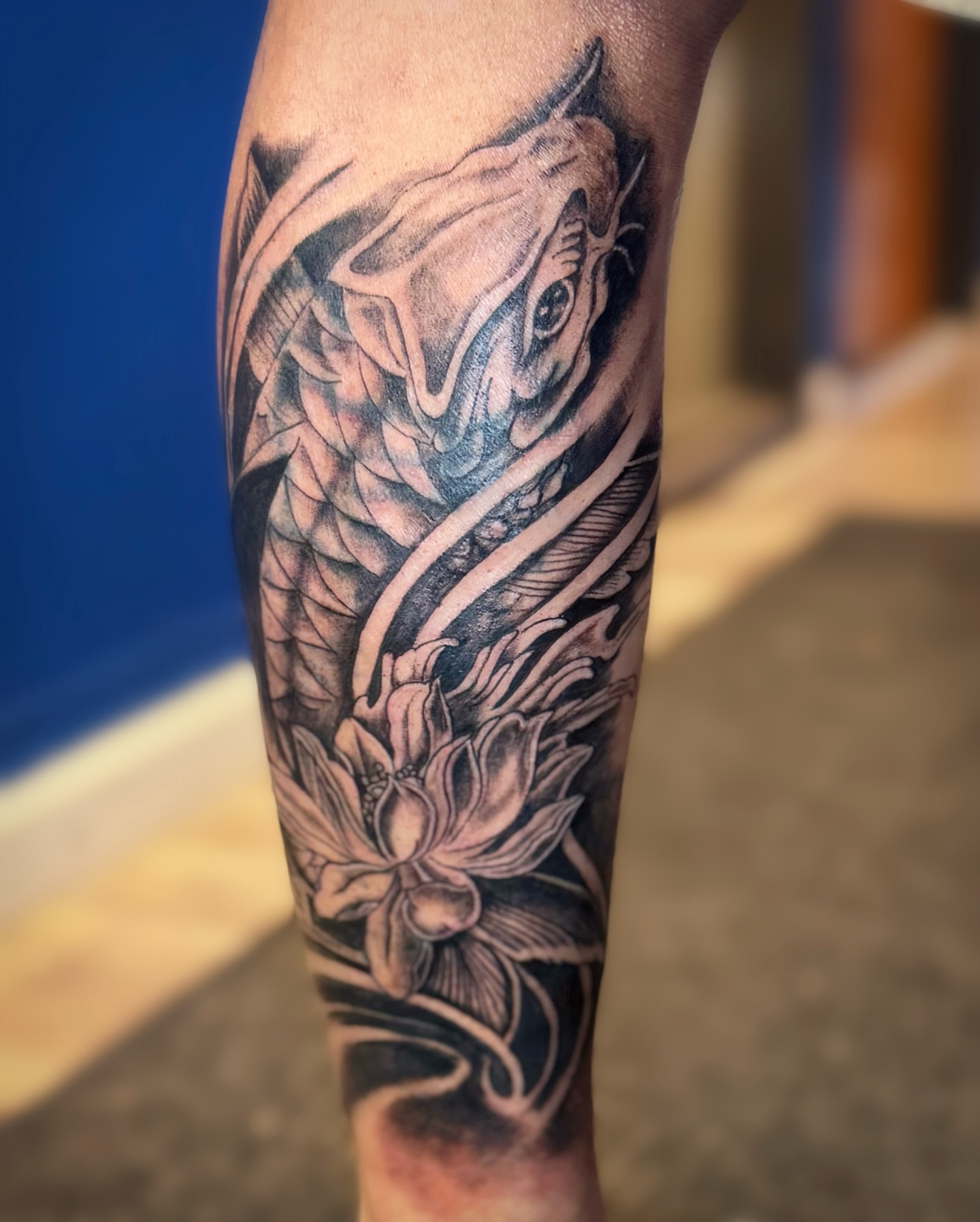 Dragon and lotus realism tattoo on the forearm by Kate