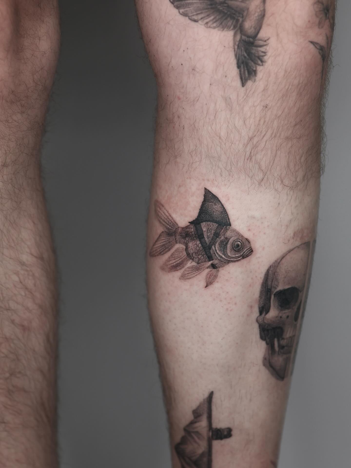 Fish black and grey tattoo on the forearm by Stephanie Pedraza