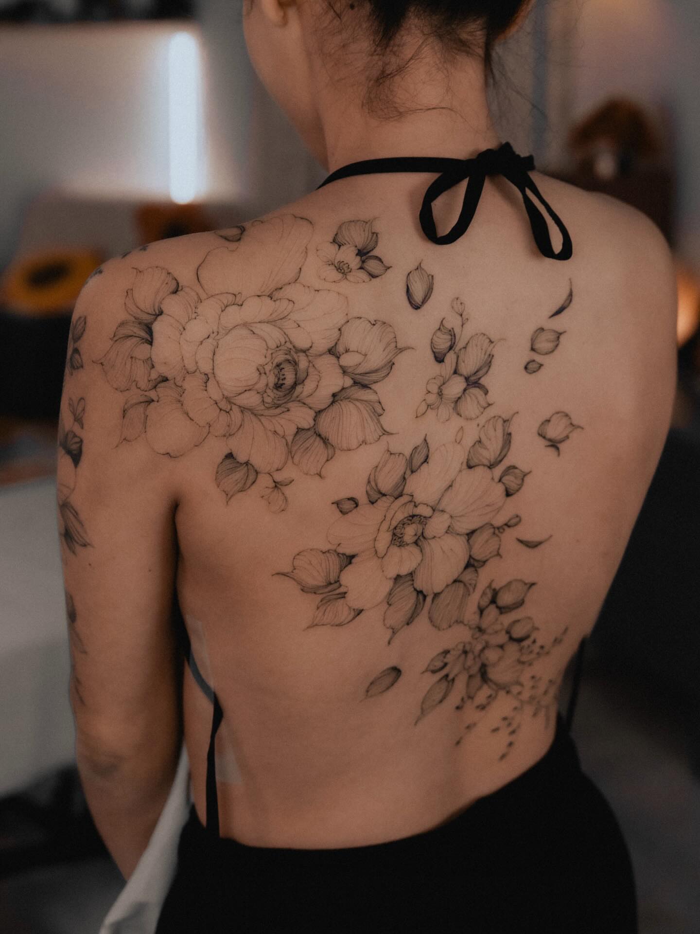 Floral bouquet realism tattoo on the back by Marek