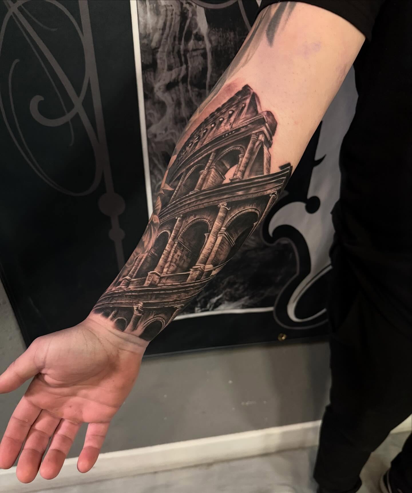 Colosseum realism tattoo on the forearm by Cody Pappas