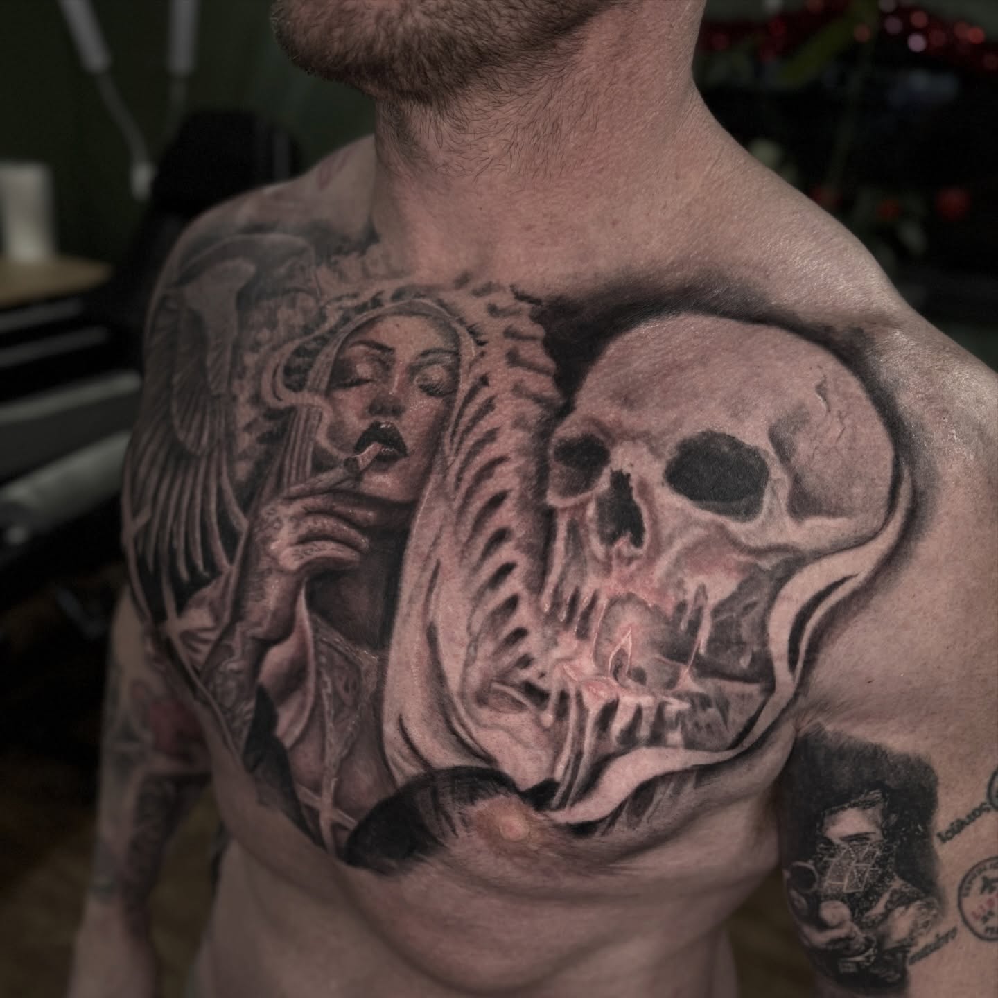 Skull and angel realism tattoo on the chest by Romi Utah Tattoo