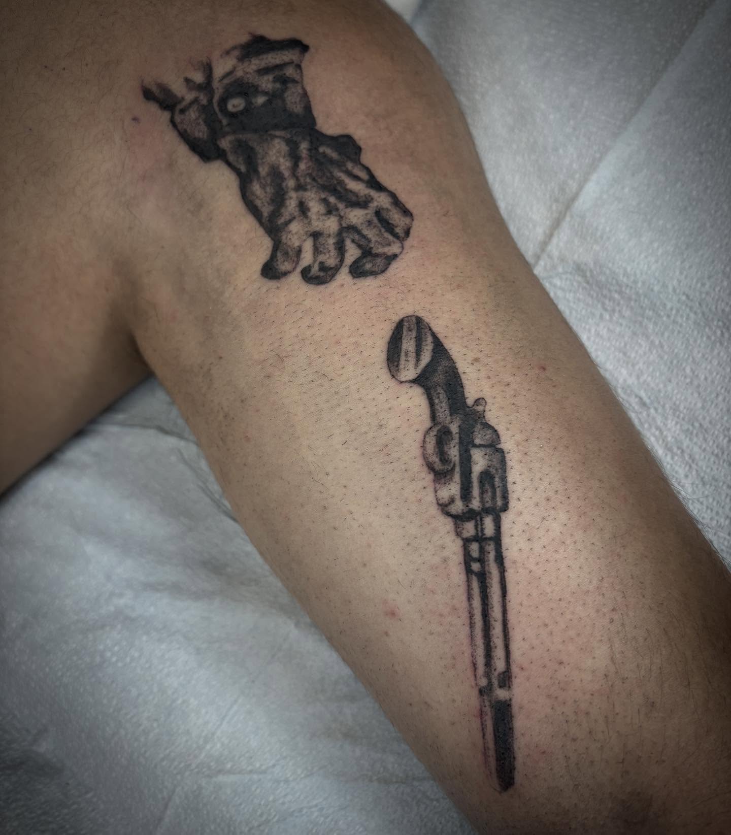 Gun and hand black and grey tattoo on the forearm by dayton skuse, Portland, Oregon
