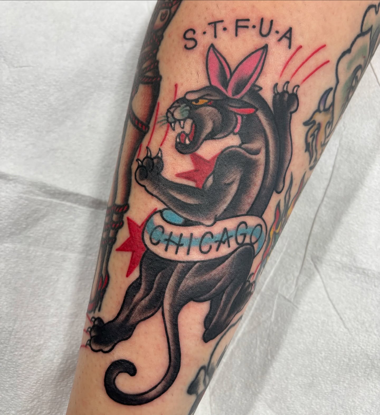 Panther with banner American traditional tattoo on the forearm by Cody Wallenius, Merrillville, Indiana