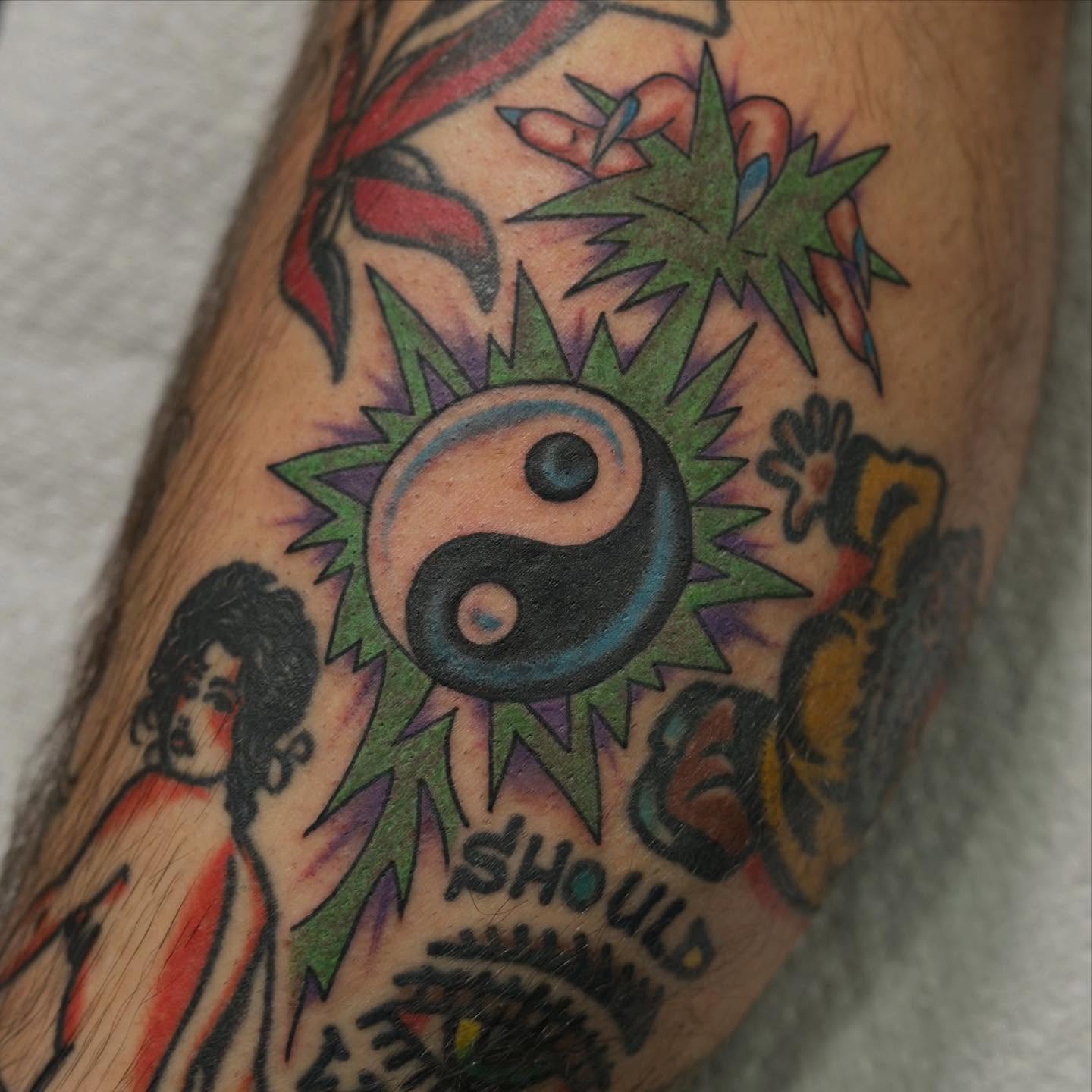 Yin-yang symbol American traditional tattoo on the forearm by Alexa Wolfkiel