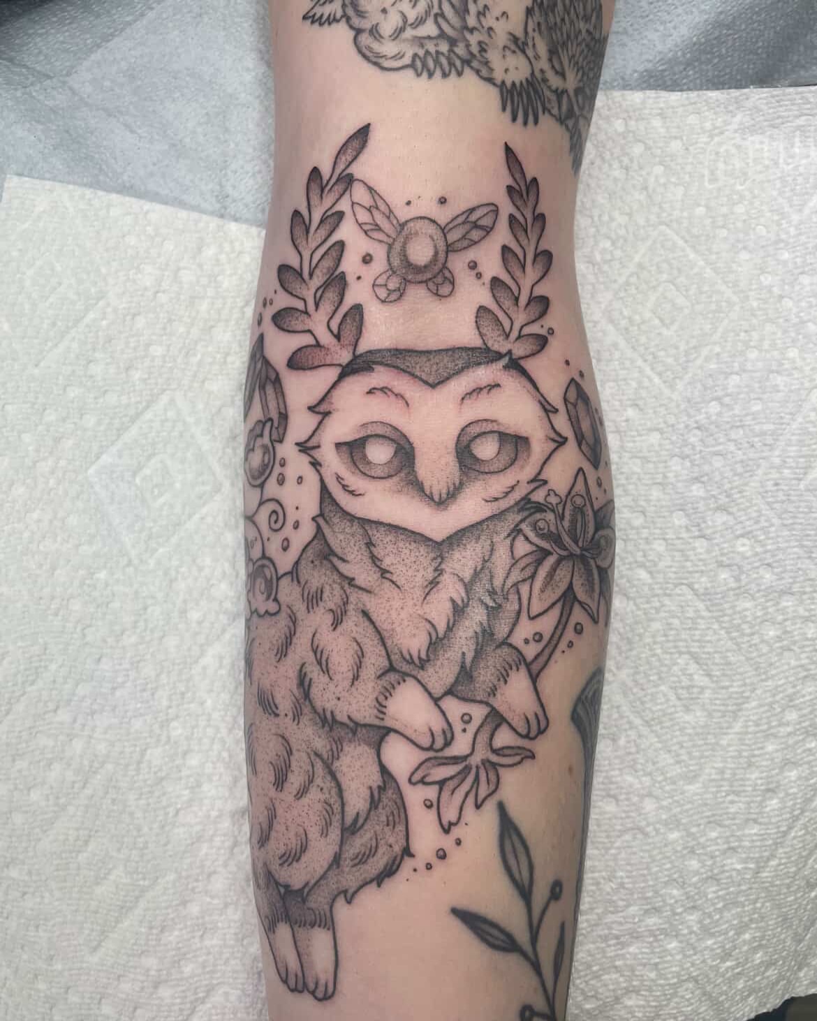 Owl black and grey tattoo on the forearm by Fionna Fanning