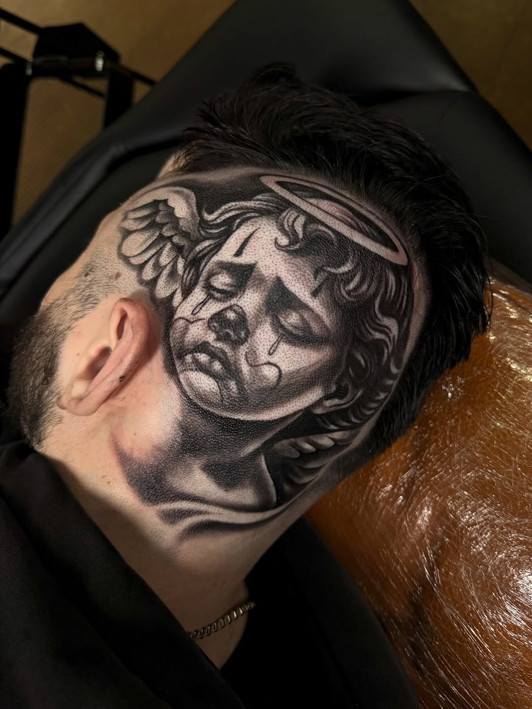 Angelic face with clown makeup realism tattoo on the head by inkzombi