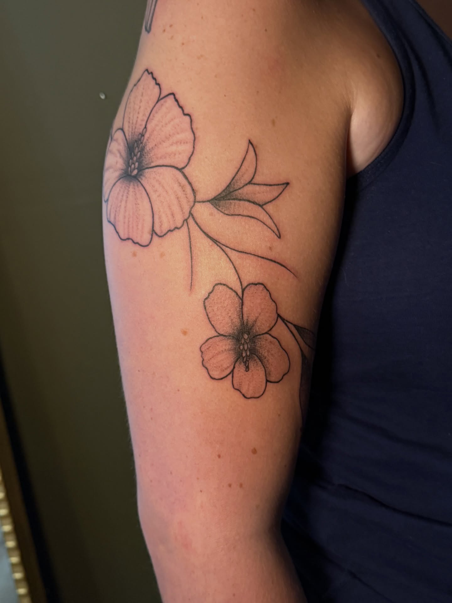 Flowers black and grey tattoo on the forearm by Whimsical illustrative