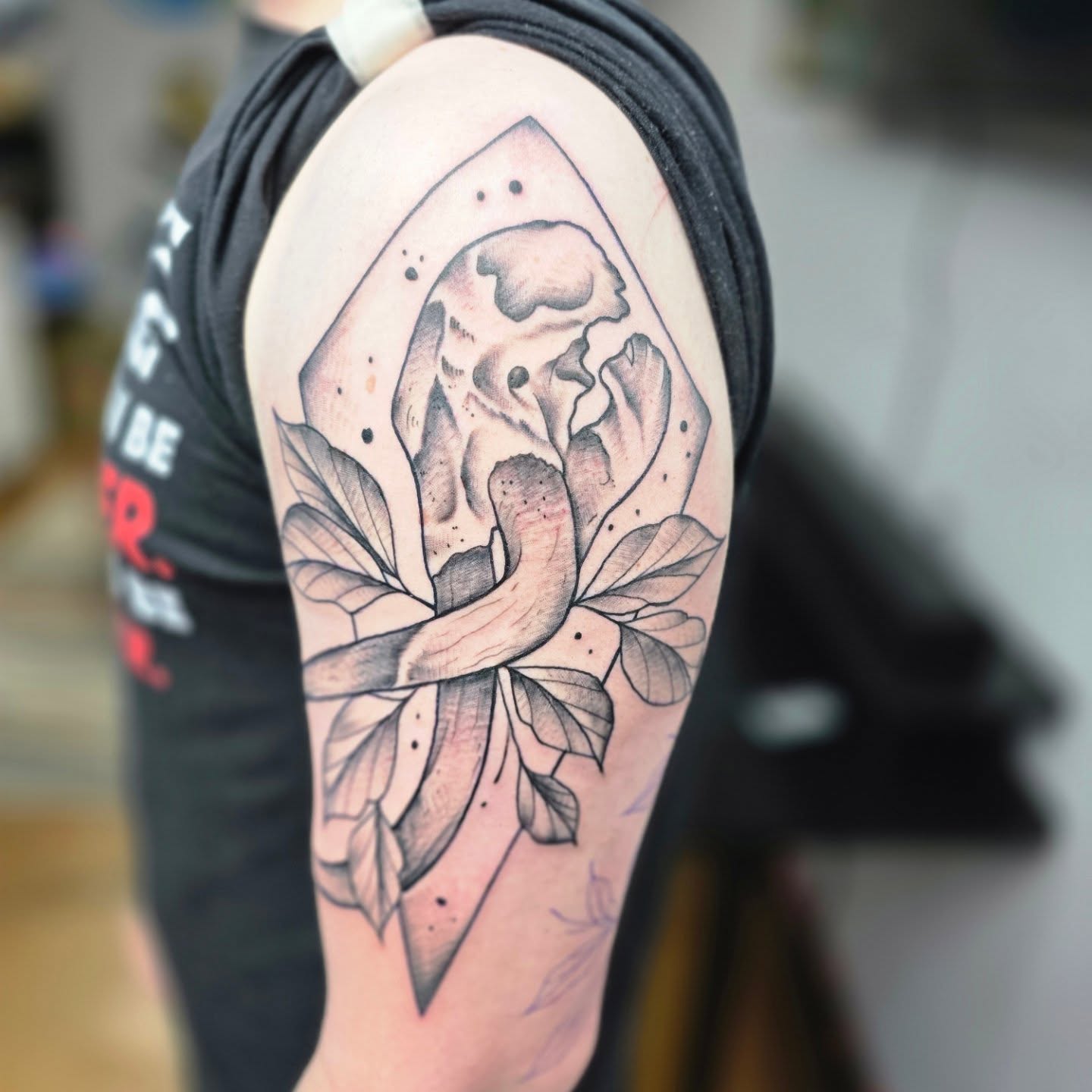 Flower black and grey tattoo on the upper arm by Jon Griffin, Maryville, Tennessee