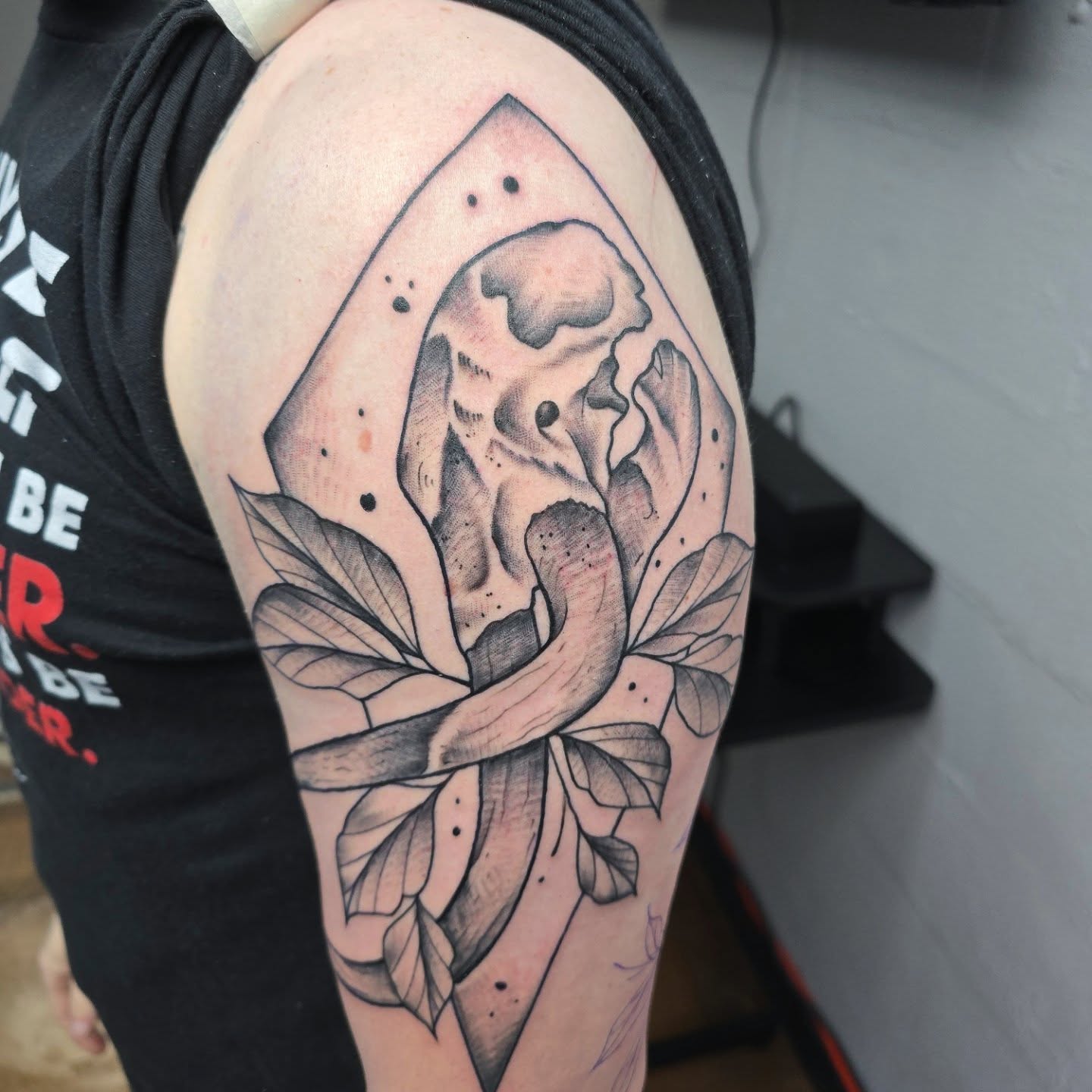 Lotus flower geometric tattoo on the shoulder by Jon Griffin, Maryville, Tennessee